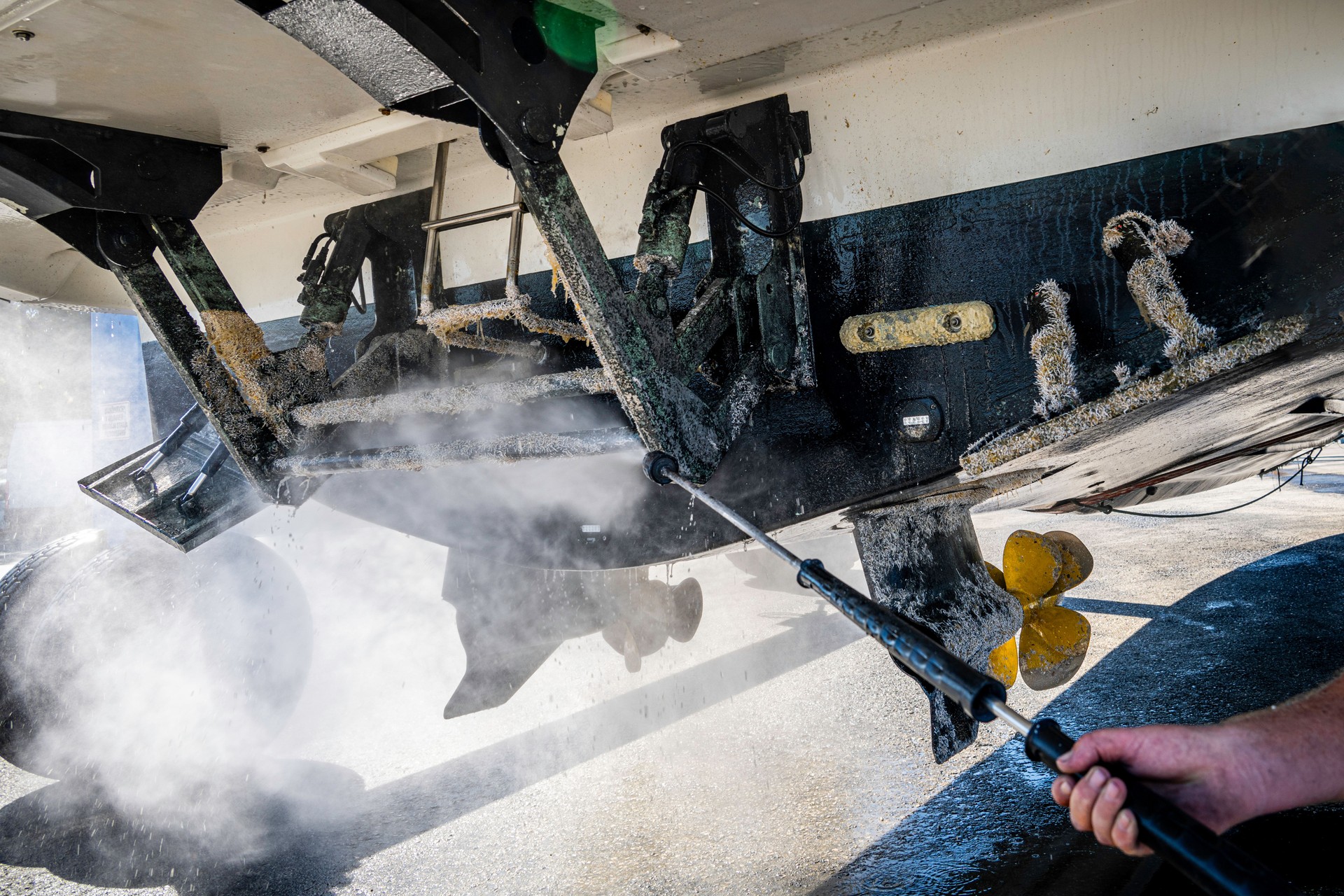 Power washing on a yacht in dry dock